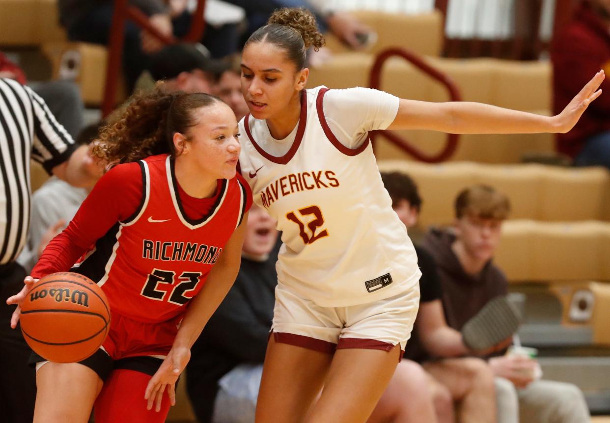Richmond Red Devils Kiarra Handley (22) is fouled by McCutcheon Mavericks Lillie Graves (12) during the IHSAA girl’s basketball game, Saturday, Jan. 6, 2024, at McCutcheon High School in Lafayette, Ind.
