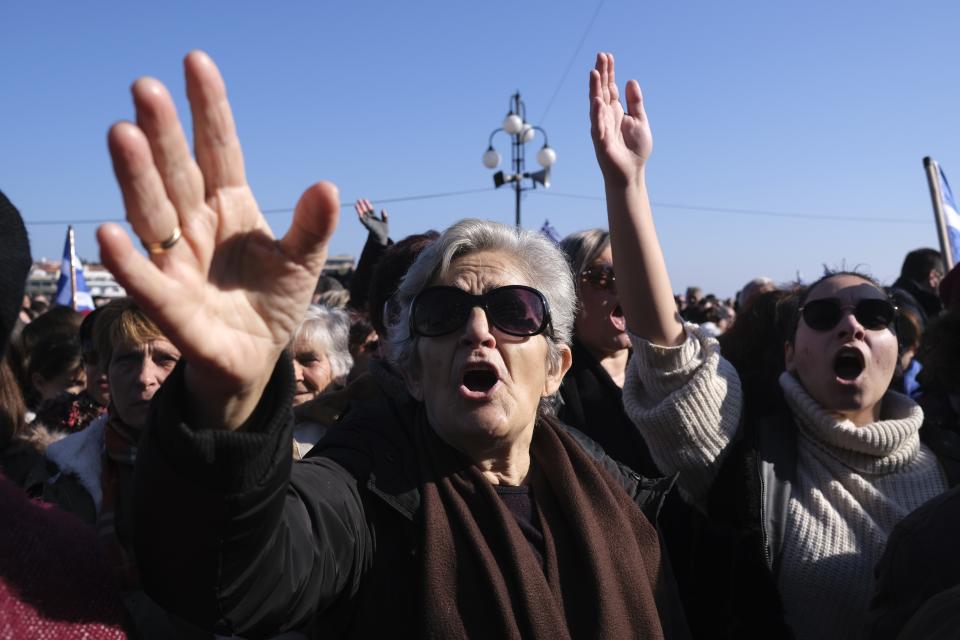 Protesters shout slogans outside the Municipality of Mytilene during a rally on the northeastern Aegean island of Lesbos, Greece, on Wednesday, Jan. 22, 2020. Local residents and business owners have launched a day of protest on the Greek islands hardest hit by migration, demanding the Greek government ease severe overcrowding at refugee camps. (AP Photo/Aggelos Barai)