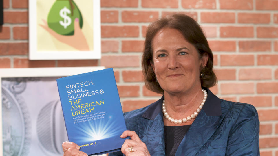 Karen Mills holds up her book, "Fintech, Small Business & the American Dream: How Technology Is Transforming Lending and Shaping a New Era of Small Business Opportunity" in Yahoo Finance's studio.