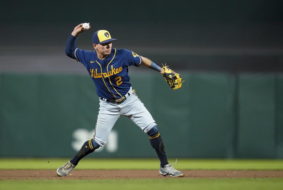 Milwaukee Brewers third baseman Luis Urías throws to first base for the out on San Francisco Giants' Brandon Crawford during the eighth inning of a baseball game in San Francisco, Friday, July 15, 2022. (AP Photo/Godofredo A. Vásquez)