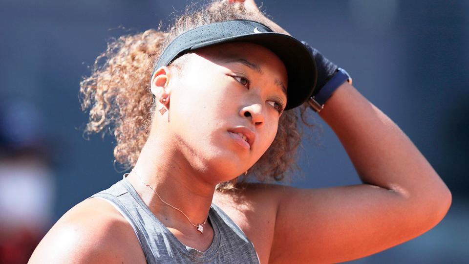 Naomi Osaka is pictured here looking frustrated during a match on clay.