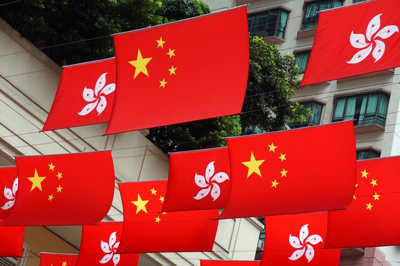 Chinese and Hong Kong flags decorate a street in Hong Kong