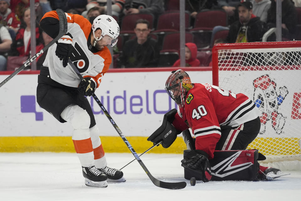 Chicago Blackhawks goaltender Arvid Soderblom makes a save against Philadelphia Flyers center Ryan Poehling during the first period of an NHL hockey game Wednesday, Feb. 21, 2024, in Chicago. (AP Photo/Erin Hooley)