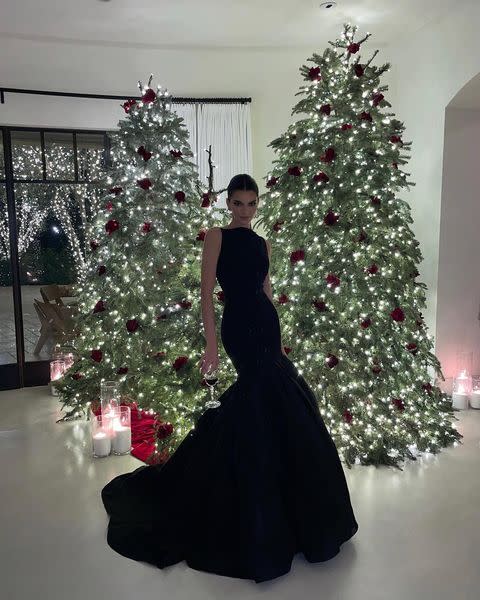 <p>In true Kardashian style, Kendall Jenner pulled out all the stops to celebrate Christmas this year – and her outfit was no different. For the festivities, Jenner wore a dramatic black gown by Carolina Herrera – accessorised only with earrings and a glass of wine. </p><p><a href="https://www.instagram.com/p/CX4_NIQrQk7/" rel="nofollow noopener" target="_blank" data-ylk="slk:See the original post on Instagram;elm:context_link;itc:0;sec:content-canvas" class="link ">See the original post on Instagram</a></p>