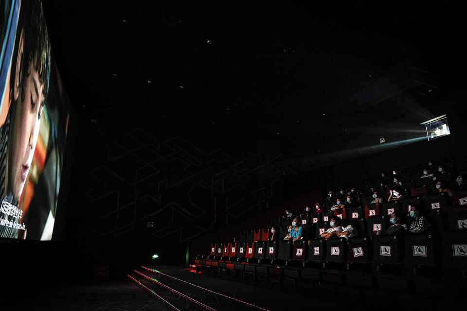 WUHAN, CHINA - JULY 20: (CHINA OUT)Residents watch a movie in a cinema in Wuhan on July 20, 2020 in Wuhan ,Hubei Province,China.Taking various measures against COVID-19, cinemas in the city reopened in an orderly manner on Monday. The China Film Administration, in a circular last week, allowed cinemas in low-risk areas to resume operation with effective epidemic prevention measures in place. (Photo by Getty Images)