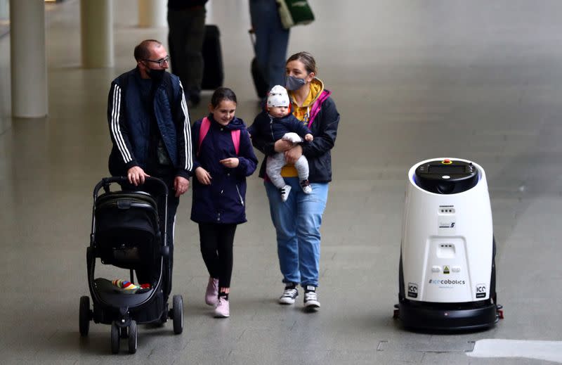 An Ultrasonic Disinfection Atomiser cleaning robot, known as an Eco Bot 50 cleans St Pancras International station in London