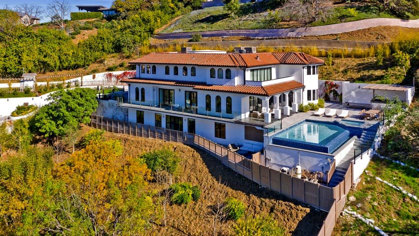 Retired basketball star Dwyane Wade and his actress wife, Gabrielle Union, listed the Sherman Oaks residence for $6.2 million. The three-story villa is navigated by a sculptural staircase that runs through the heart of the home. The 8,650-square-foot floor plan also has an elevator. The house sits on three-quarters of an acre with city and valley views. An infinity-edge swimming pool, lounge, fenced play yard and outdoor kitchen make up the grounds.