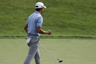 Collin Morikawa reacts to making a putt on the 18h green during the third round of the Workday Charity Open golf tournament, Saturday, July 11, 2020, in Dublin, Ohio. (AP Photo/Darron Cummings)