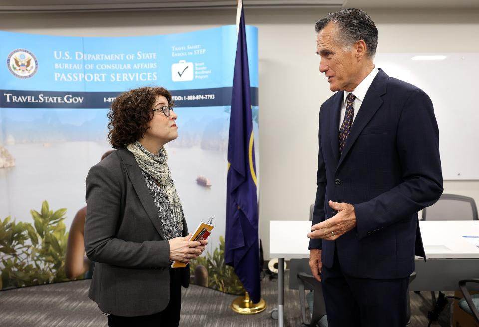 U.S. Assistant Secretary of State for Consular Affairs Rena Bitter and Sen. Mitt Romney, R-Utah, talk while visiting the State Department’s Salt Lake City Passport Fair at the Bennett Federal Building in Salt Lake City on Friday, Feb. 16, 2024. | Kristin Murphy, Deseret News
