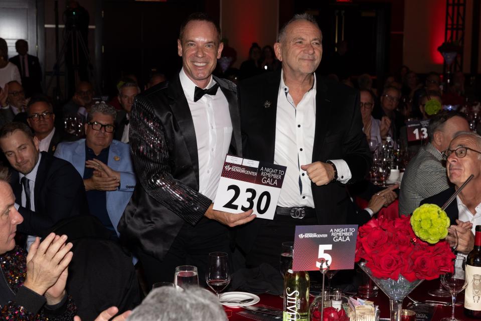 Presenting sponsors Steve Tobin and Johnny Krupa of the Grace Helen Spearman Charitable Foundation make a bid at "A Night to Remember," the Cathedral City Senior Center's fundraising gala, on Nov. 13, 2023.