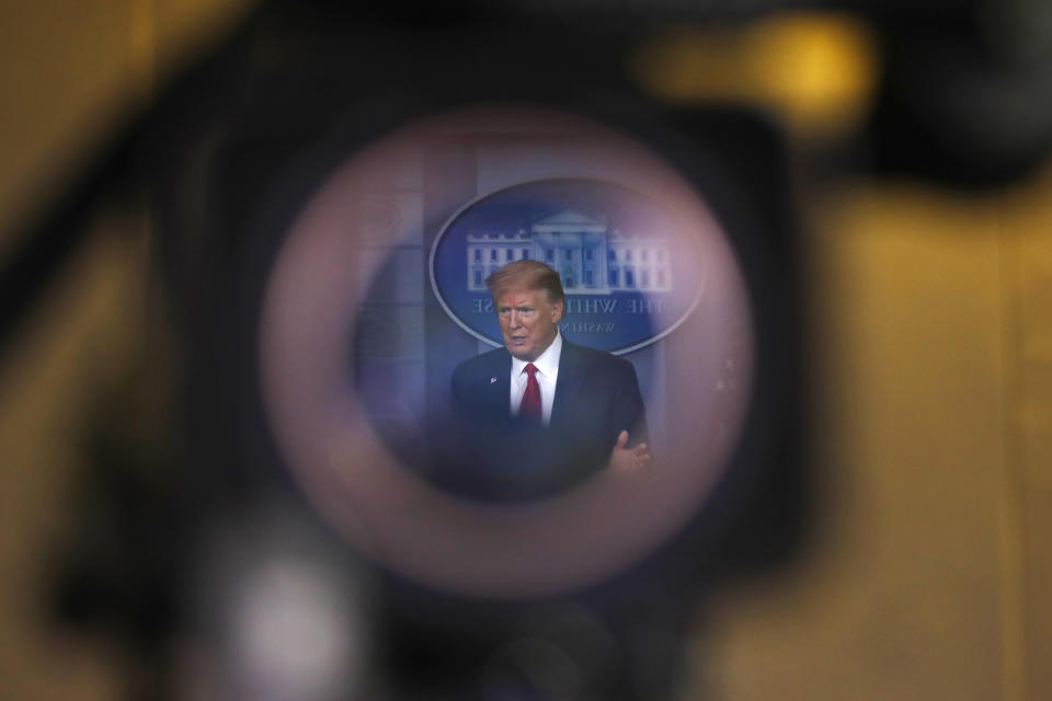 FILE - In this April 22, 2020, file photo seen through a video eyepiece, President Donald Trump speaks about the coronavirus in the James Brady Press Briefing Room of the White House in Washington. According to a new survey from The Associated Press-NORC Center for Public Affairs Research, 28% of Americans say they’re regularly getting information from Trump about the coronavirus and 23% say they have high levels of trust in what the president is telling the public. (AP Photo/Alex Brandon, File)