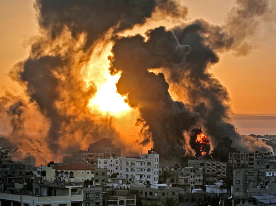 A fire rages at sunrise in Khan Yunish following an Israeli airstrike on targets in the southern Gaza stripYoussef Massoud/AFP via Getty Images