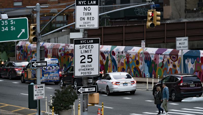 A sign, indicating to drivers that right turns on red are not allowed within city limits, is displayed near the Manhattan exit of the Lincoln Tunnel in New York, Thursday, Nov. 2, 2023. A growing number of cities across the United States are considering banning right turns on red lights. 