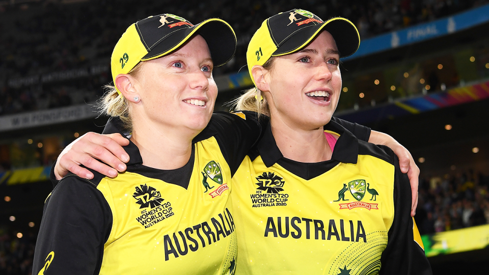 Alyssa Healy (pictured left) and Elyse Perry (pictured right) celebrate the 2020 T20 World Cup win.