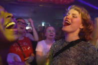 In this image taken from video, Taylor Swift fans sing and dance at a nightclub event called 'Ready for It' that only plays Swift's music in Gothenburg, Sweden, on Tuesday, April 30th, 2024. Swift is scheduled to kick off the 18-city Europe leg of her record-setting Eras Tour on Thursday, May 9, 2024. There will be three shows in Stockholm. (AP Photo/Chisato Tanaka)