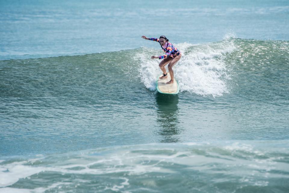 Research shows that surfers are among the happiest people. Dr. Diana Wehrell-Grabowski's film "Waves of Emotion" explores surfers' connection to the sport through local narratives. The film will debut at Surfside Playhouse on Saturday, July 8, 2023.