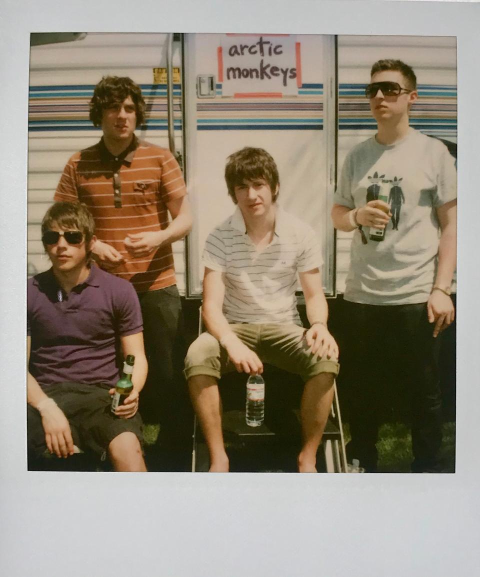 Members of the Arctic Monkeys in front of their trailer