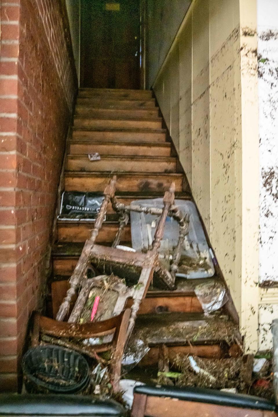Debris litters a stairway July 12, 2023 at the Weston Playhouse, two days after flooding hit the Weston Theater Company.