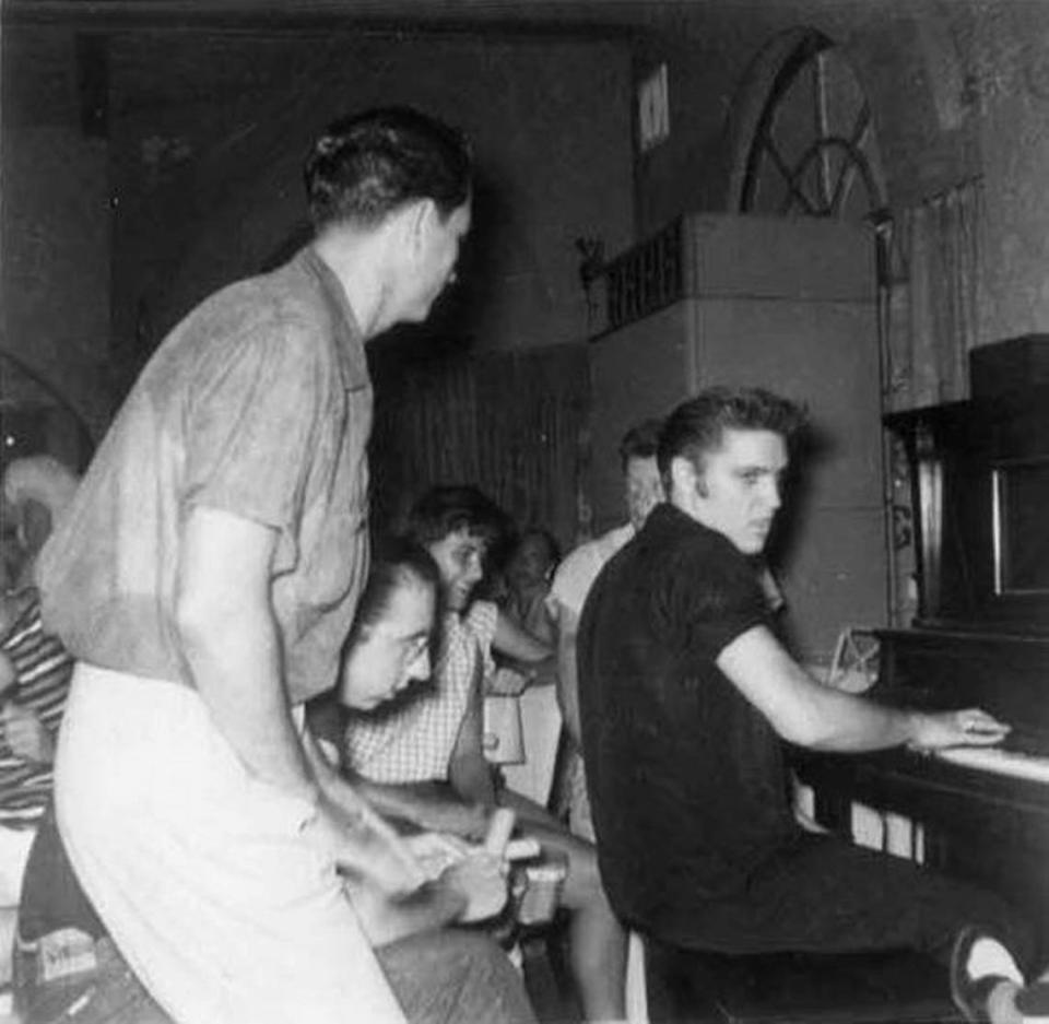 Elvis Presley plays piano at the Pink Pony club in Gulf Hills, in August of 1956