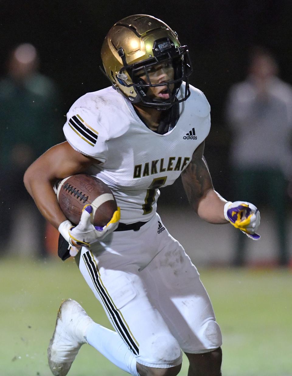 Oakleaf defensive back Dylan Stubbs carries the ball in a November 2021 game against Fleming Island.