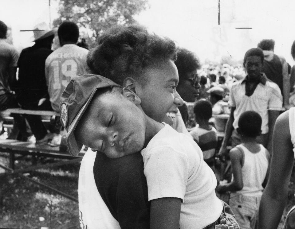 Black festival, etc. at Chickasaw Park. June 21, 1980. Photo by Robert SteinauNeil Lewis, Jr. (2) didn't let the crowd and rock band keep him from napping on the shoulder of his mother Gisele Williams. They live near Shively.