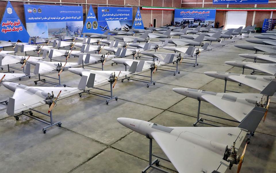 military unmanned aerial vehicles (UAV or drone) on display during a ceremony at an undisclosed location in Iran