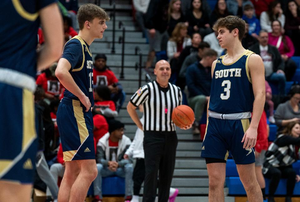 Council Rock South's Gabe Cerulli (12) talks to teammate Timmy Rahill (3) right before a Jan. 26 game against Neshaminy.