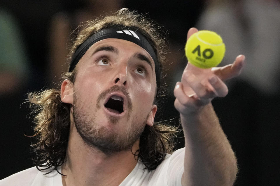 Stefanos Tsitsipas of Greece serves to Jiri Lehecka of the Czech Republic during their quarterfinal match at the Australian Open tennis championship in Melbourne, Australia, Tuesday, Jan. 24, 2023. (AP Photo/Aaron Favila)