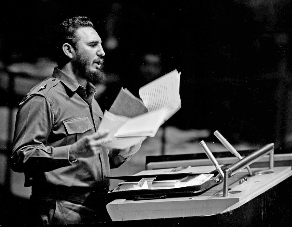 FILE - In this Sept. 26, 1960, file photo, Cuban Premier Fidel Castro waves a document during his talk to the United Nations General Assembly. The sheen and spectacle of his first visit to New York City in 1959 gave away to subsequent visits as an effective enemy of the state railing from the U.N. podium at those he characterized as his country’s capitalist oppressors. (AP Photo/File)