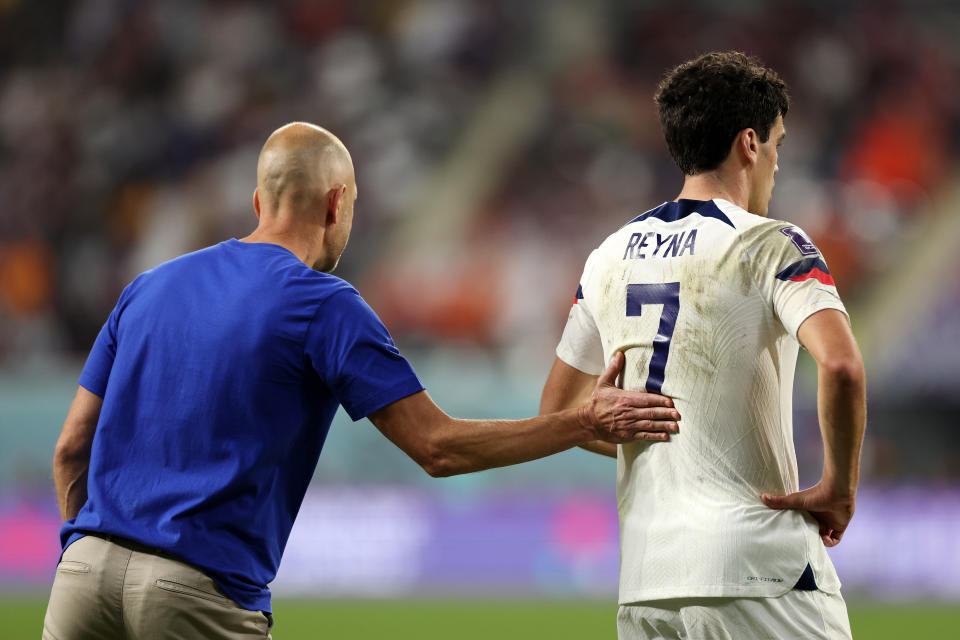 DOHA, QATAR - DECEMBER 03: Gregg Berhalter, Head Coach of United States, gives instruction to Giovanni Reyna during the FIFA World Cup Qatar 2022 Round of 16 match between Netherlands and USA at Khalifa International Stadium on December 03, 2022 in Doha, Qatar. (Photo by Patrick Smith - FIFA/FIFA via Getty Images)