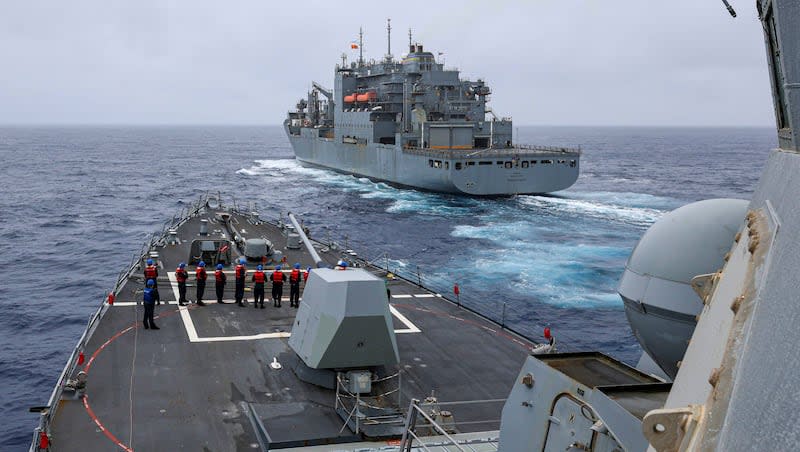 In this photo released by the U.S. Navy, the Arleigh Burke-class guided-missile destroyer USS John Finn (DDG 113) prepares to come alongside Lewis and Clark-class dry cargo ship Cesar Chavez (T-AKE-14) in the East China Sea, on Jan. 21, 2024. China has accused the U.S. of abusing international law with its military maneuvers in the western Pacific, one day after the American naval destroyer sailed through the politically sensitive Taiwan Strait.