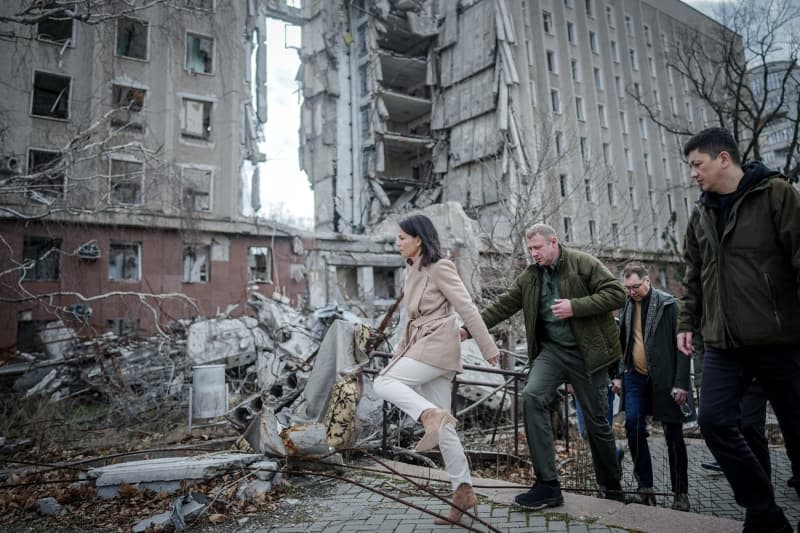 German Foreign Minister Annalena Baerbock visits the former headquarters of the regional administration of Mykolaiv Oblast during her two-day visit to Ukraine. On March 29, 2022, the building was hit by Russian missiles and almost completely destroyed. Kay Nietfeld/dpa