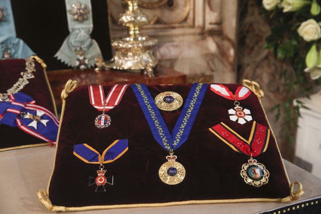 The Order of Australian Knight, the Order of New Zealand, the order of Canada, the Canada Order of Military Merit, and the Papua New Guinea Order of Logohu, were placed on the altar (Steve Parsons/PA)