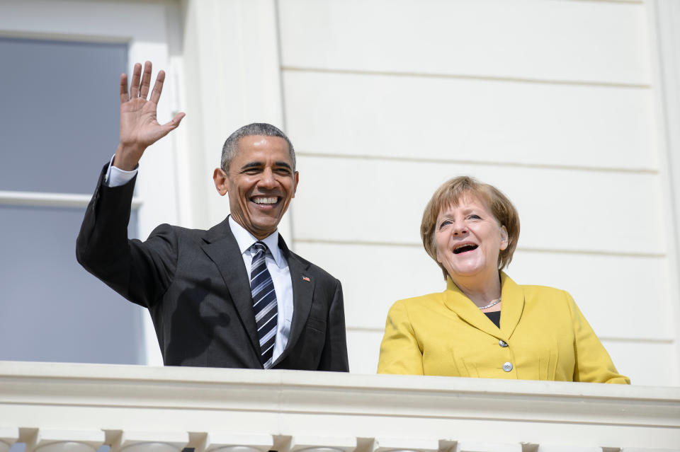 Obama waves during a welcome ceremony at Herrenhausen Palace accompanied by Merkel on Obama's first day of a two-day trip to Germany on April 24 in Hanover, Germany.