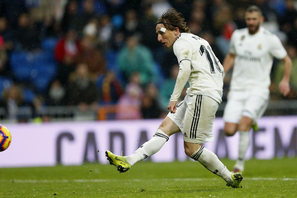 Real Madrid's Luka Modric scores his team's second goal during a La Liga soccer match between Real Madrid and Sevilla at the Bernabeu stadium in Madrid, Spain, Saturday, Jan. 19, 2019. (AP Photo/Andrea Comas)