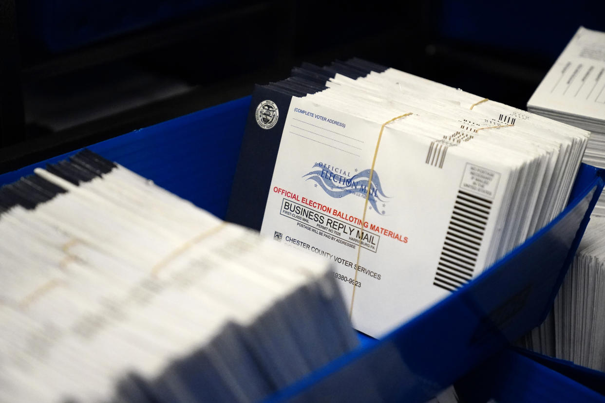 Mail-in ballots for the 2020 General Election in the United States are seen after being sorted at the Chester County Voter Services office on Oct. 23, 2020, in West Chester, Pa. (Matt Slocum/AP)