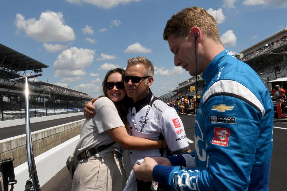 Ashley Newgarden hugs Ed Carpenter as Team Penske driver Josef Newgarden (2) prepares to get in his car Saturday, July 30, 2022, during the Gallagher Grand Prix at Indianapolis Motor Speedway.