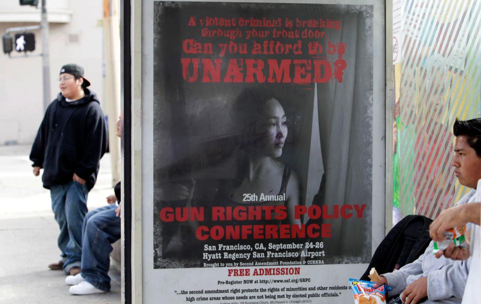 an ad at a bus station for a gun rights conference