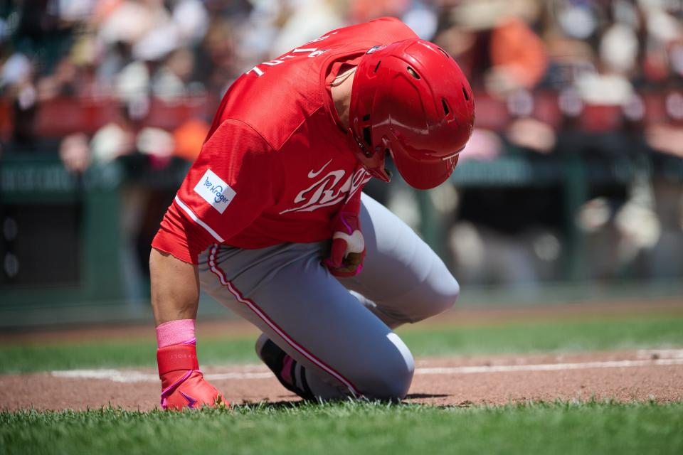 TJ Friedl is hit on the left thumb by a pitch in Sunday's game in San Francisco.