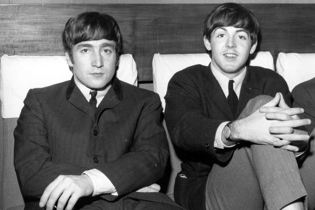 <p>Fox Photos/Getty </p> John Lennon and Paul McCartney in 1963