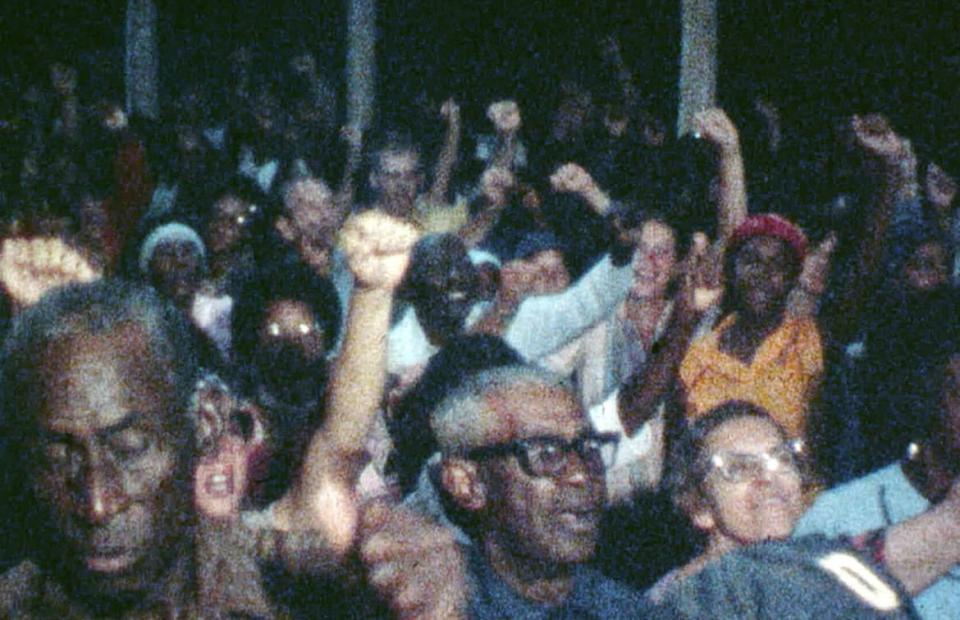 Peoples Temple members congregate during an event in Jonestown, Guyana.