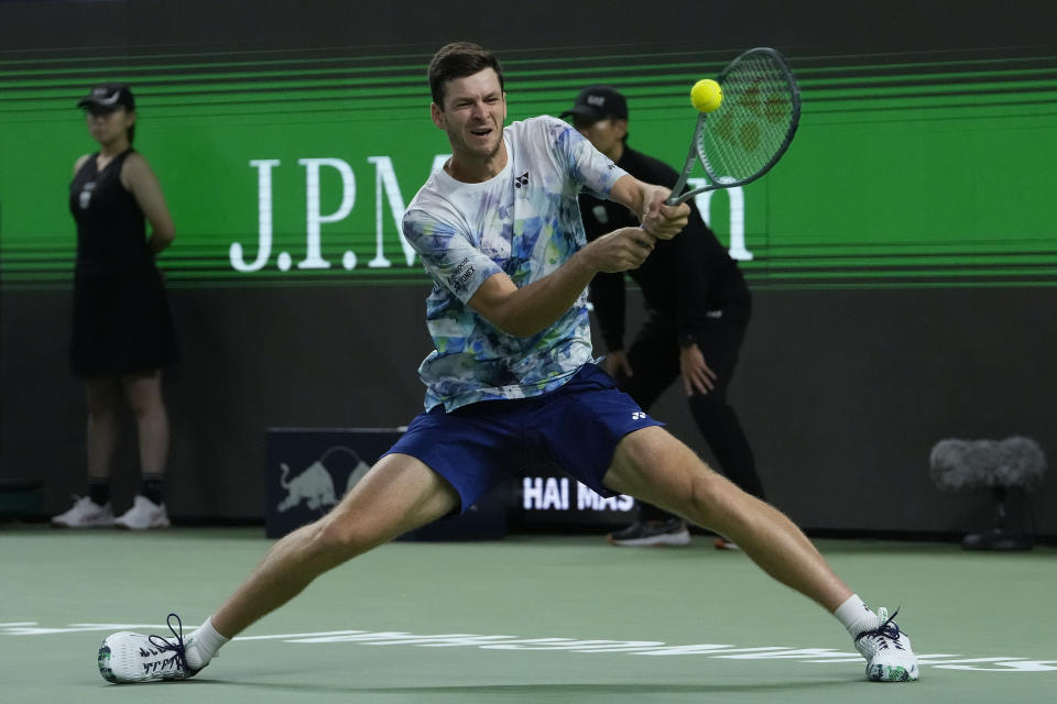 Hubert Hurkacz of Poland returns a shot to Fabian Marozsan of Hungary during the men's singles quarterfinal match in the Shanghai Masters tennis tournament at Qizhong Forest Sports City Tennis Center in Shanghai, China, Thursday, Oct. 12, 2023. (AP Photo/Andy Wong)