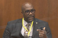 In this image from video, Philonise Floyd, brother of George Floyd, testifies as Hennepin County Judge Peter Cahill presides over court Monday, April 12, 2021, in the trial of former Minneapolis police Officer Derek Chauvin, in the May 25, 2020, death of George Floyd at the Hennepin County Courthouse in Minneapolis, Minn. (Court TV via AP, Pool)