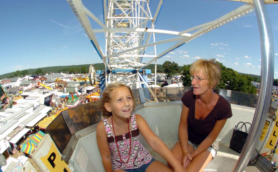 Jill Hill and her daughter Hailey Jimenez, of Dayville, enjoy the sights from the Ferris wheel at the Woodstock Fair last year.