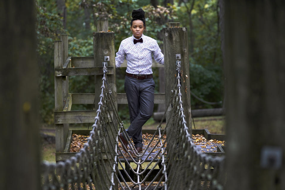 Annie Hobson, director of the Camp Hope, one of the programs Rockford, Ill., is offering not only for kids who are victims, but those who are present when domestic abuse is occurring, poses for a portrait near one of many obstacle course challenges at Atwood Park, Monday, Sept. 20, 2021, in Rockford, Ill. For kids between 8-11 who made the trip to the park, Hobson believes it makes perfect sense that kids exposed to violence might become violent themselves. "That's what they've seen. That's what they know," she said, adding that the campers leave with better coping skills and a mentor they will connect with throughout the year. The money flowing to cities and states from the American Rescue Plan is so substantial and can be used for so many purposes that communities across the U.S. are trying out new, longer-term ways to fix what’s broken in their cities. (AP Photo/Charles Rex Arbogast)