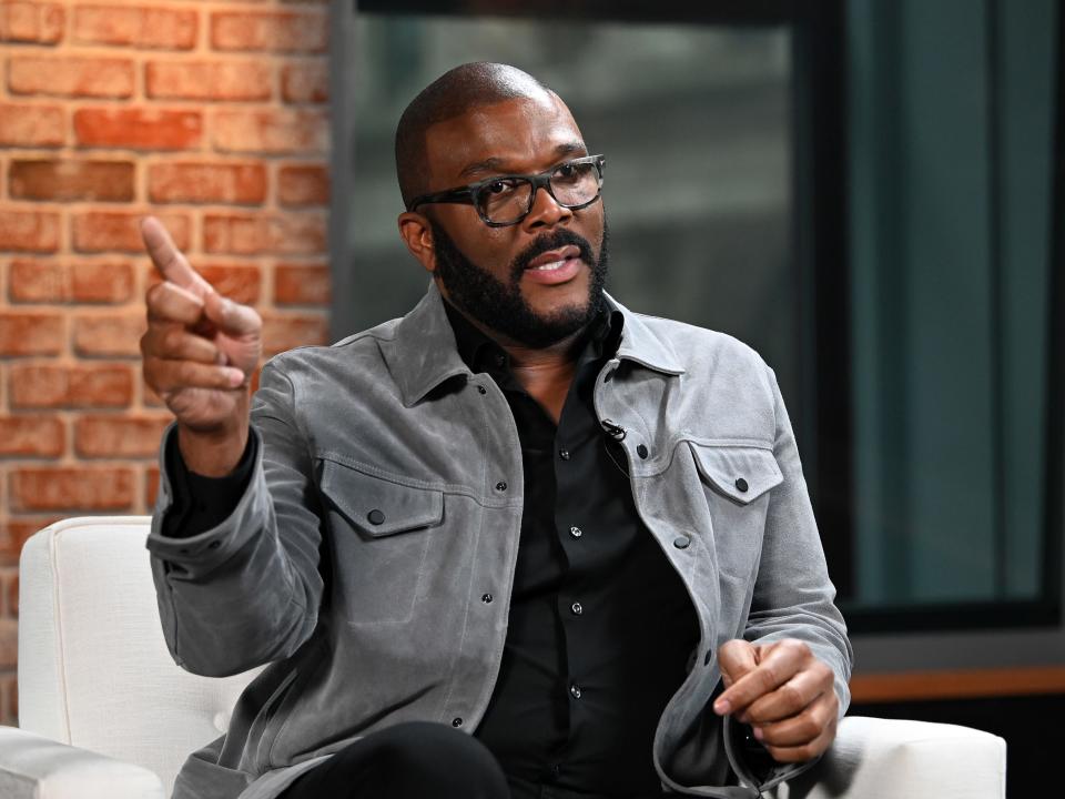 Tyler Perry gestures as he speaks