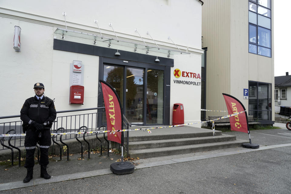 Police cordon off a supermarket in Kongsberg, Norway, Thursday, Oct. 14, 2021, after a man killed several people. Police in Norway are holding a 37-year-old man from Denmark suspected in a bow-and-arrow attack in a small town that killed five people and wounded two others. (Terje Pedersen/NTB via AP)