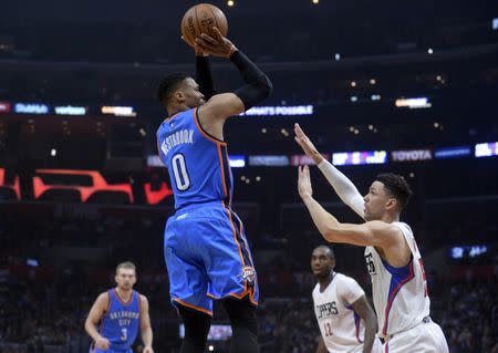 January 16, 2017; Los Angeles, CA, USA; Oklahoma City Thunder guard Russell Westbrook (0) shoots against the defense of Los Angeles Clippers during the first half at Staples Center. Mandatory Credit: Gary A. Vasquez-USA TODAY Sports