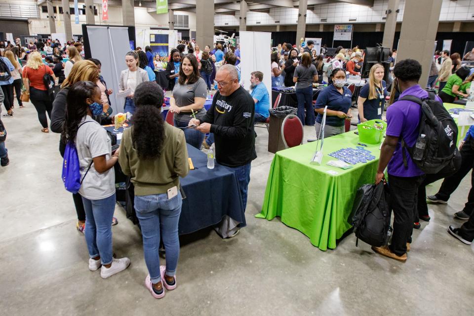 An Amazon representative speaks with high school students from the Big Bend area during the Leon Works Expo on April 22.