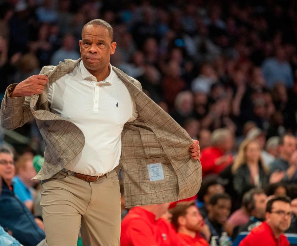 North Carolina coach Hubert Davis removes his coat after an argument with the officials following a technical foul on Armando Bacot (5) during the first half against Connecticut in the Jimmy V Classic on Tuesday, December 5, 2023 at Madison Square Garden in New York, NY.